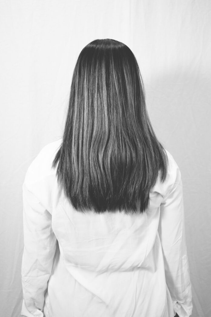 woman in white long sleeve shirt
